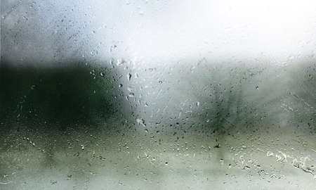 Rain drops on window glass. Raindrops on window glass. Rain drops on window.