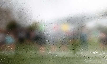 Water drops on glass with blurred background. Raindrops on window with blurred background.