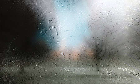 Rain drops on the glass, blurred background. Raindrops on the window.の写真素材