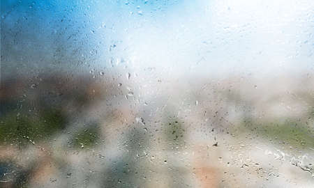 Background with rain drops close up. Rain drops on outdoor window, Closeup view transparent water...
