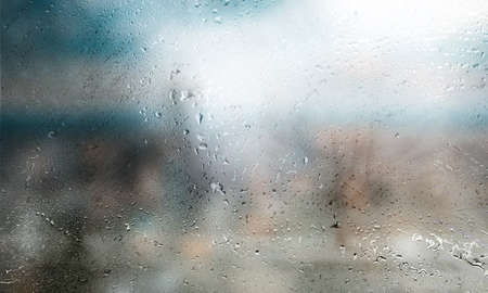 Background with rain drops close up. Rain drops on outdoor window, Closeup view transparent water...
