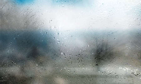 Background with rain drops close up. Rain drops on outdoor window, humid water backdrop, blurred...