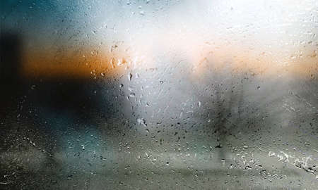 rain drops on window glass, blurred background, bokeh effect
