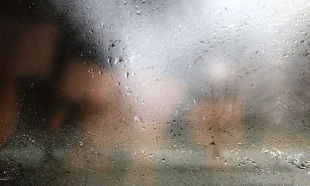 Background with rain drops close up. Rain drops on outdoor window, humid water backdrop, blurred...