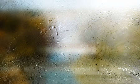 Rain drops on window glass. Raindrops on window glass. Rainy weather.