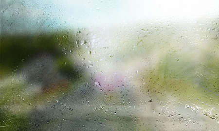 Rain drops on the window with a blurred background. Rainy weather.