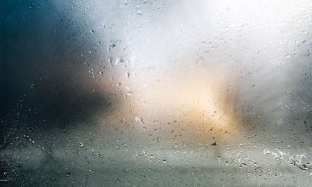 Drops of rain on the window. Rainy weather. Abstract background.の写真素材