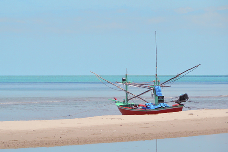 Fishing boat on the beach in Thailandの写真素材