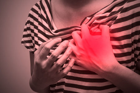 Sick woman with severe heartache, suffering from chest painの写真素材