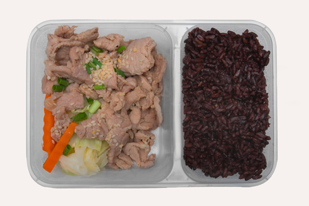 Rice berry and stir fried pork with sesame served with carrot and cabbage, Clean food conceptの写真素材