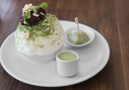Set of Korean Green tea Bingsu, sweetened condensed milk dessert, daifuku and red bean paste, serving on white ceramic plate. Unhealthy dessert conceptの写真素材