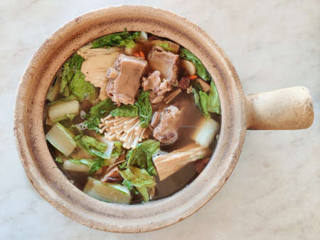 Bak kut teh serving in clay pot, a pork rib dish cooked in broth popularly served in Malaysia and Singaporeの写真素材
