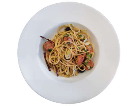 Spaghetti with Bacon Chili and Sausages, serving on white plate. isolated on white.の写真素材