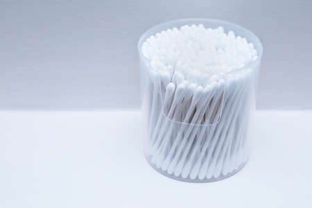 Cotton buds or cotton swabs in transparent plastic box isolated on white background.の写真素材