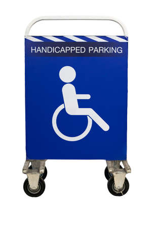 Steel barrier or traffic fence on wheel with handicapped parking sign. handicapped area. reserved parking. isolated on whiteの写真素材