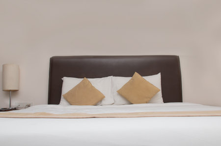 View of cozy and luxury king size bed in hotel. Asian contemporary decoration styleの写真素材