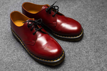Fashion classical cherry red oxblood men's leather shoes with black laces.の写真素材