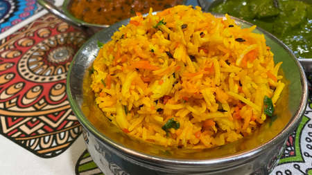 Close up image of spicy chicken biryani serving on stainless pot, traditional of Indian or Pakistani food.の写真素材