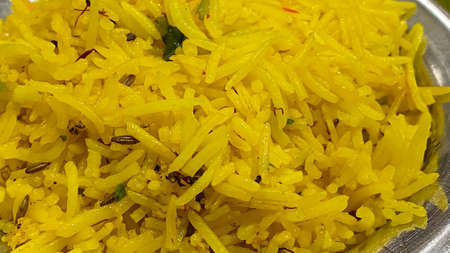 Close up image of spicy chicken biryani serving on stainless pot, traditional of Indian or Pakistani food.の写真素材