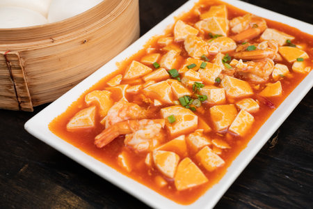 Mapo tofu, made with tofu, ground meat (pork or beef), and a spicy base sauce. Popular Chinese dish from Sichuan province.の写真素材
