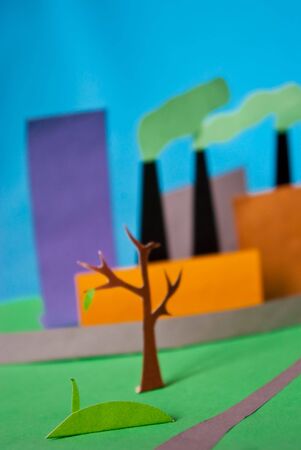 photo of a paper illustration of pollution and factory atmospheric emissionの写真素材