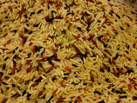 white rice & red rice in yellow lightの写真素材
