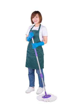 Young Asian housewife holding mop stand on white backgroundの写真素材