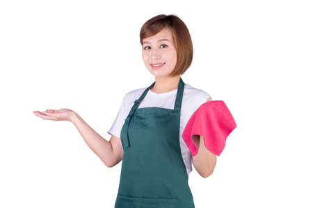 Young Asian woman in apron holding a rag and showing isolated on white backgroundの写真素材