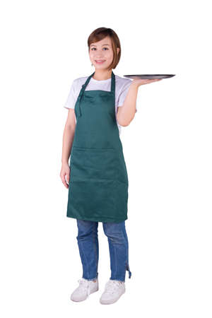 Waitress in apron holding a silver plate. Isolated on white background.の写真素材