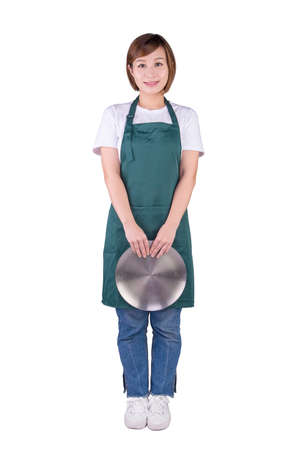Waitress in apron holding a silver plate. Isolated on white background.の写真素材