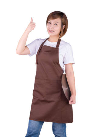 Smiling woman in apron showing thumb up on white backgroundの写真素材
