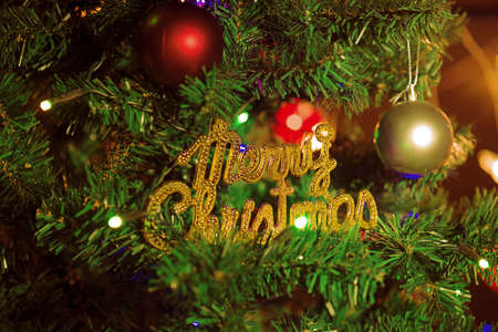 Christmas letters and balls on treeの写真素材