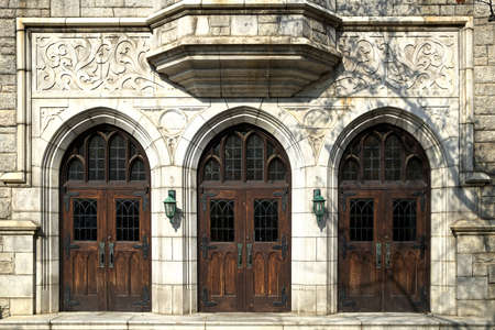 Vintage wooden front door of a church.