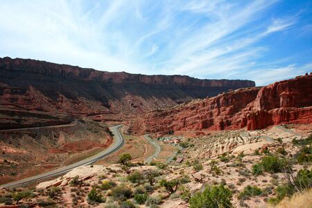 Roadway through Arches National Park - A Utah highway leads visitors to great wonders of red stone...
