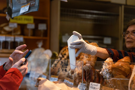 MELBOURNE, AUSTRALIA - APRIL 12, 2024: Contactless payment at the Queen Victoria Marketのeditorial素材