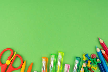 New pencil and colorfull pen are on green background for copy spaceの写真素材