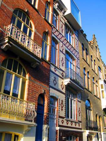 Bruges, Brugge, facades of ancient houses of an unusual shape against the blue sky, ancient architecture, Belgiumの写真素材