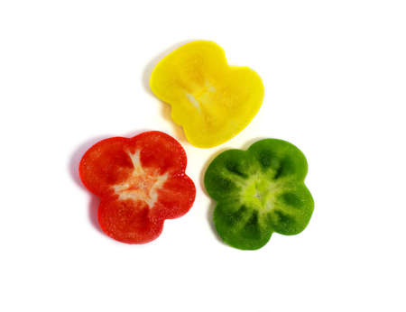 cut sweet red, green and yellow pepper isolatedの写真素材