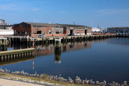 small town with wooden buildings on the sea bankのeditorial素材