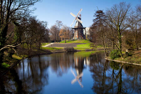 windmill and it's reflection in lake in Bremen, Germanyの写真素材