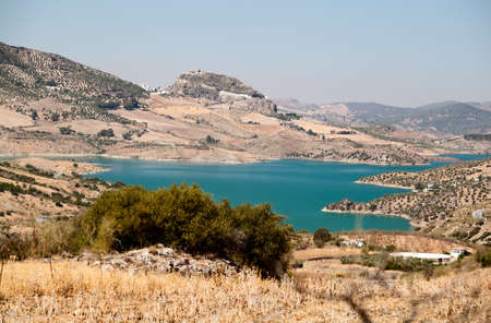 Embalse de Zahara and view on fortification in Zahara de la Sierra, Spainの写真素材