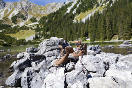 leather hiking shoeson stone  in Alpsの写真素材