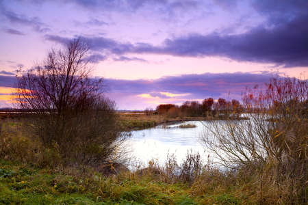 dramatic sunrise over lake in Groningen, Netherlands