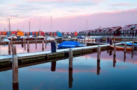 marina with many piers and yachts at Reitdiephaven during sunriseの写真素材