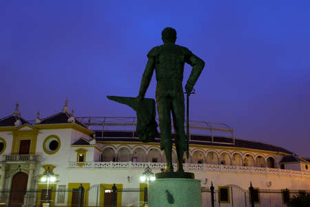 Monument by Plaza de Torros in Sevilla during sunriseの写真素材