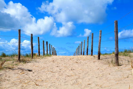 sand way to the blue sky with beautiful cloudsの写真素材