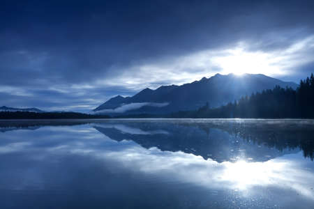sunshine over mountains and alpine lake, Bavaria, Germany