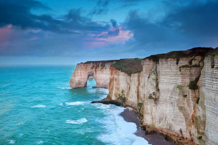 rocky cliff in azure ocean waves, Etretat, Normandie, Franceの写真素材