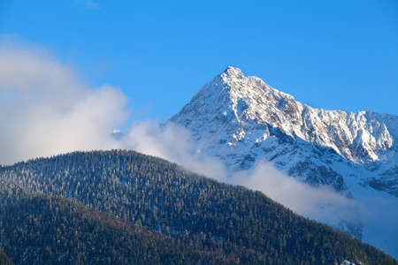 mountain peak over blue sky in winter, Germany