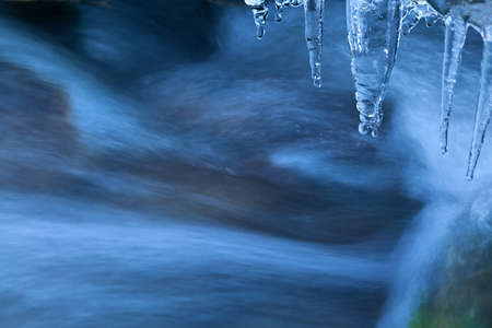 icicle and river flow in winterの写真素材